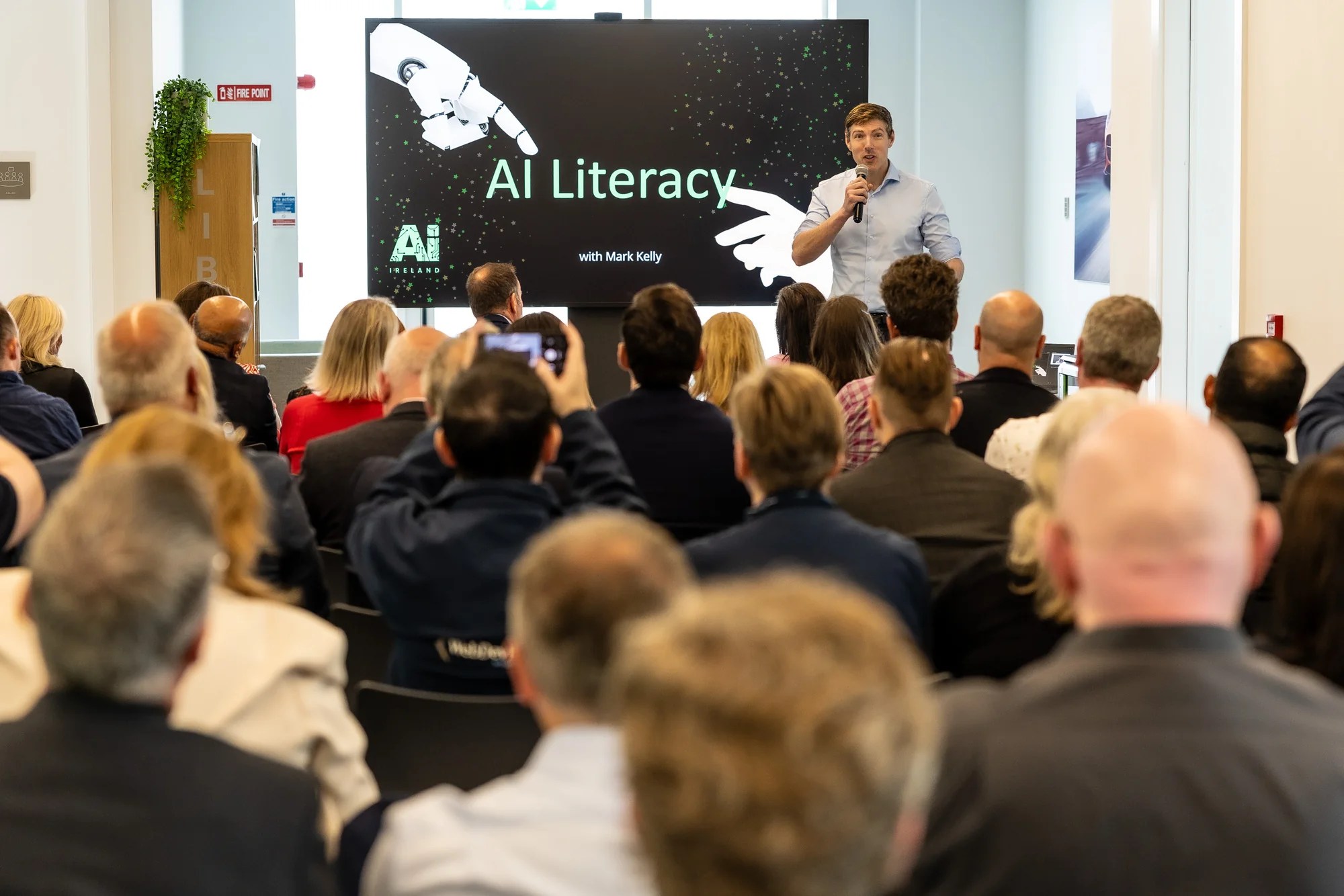 Mark Kelly speaking about AI literacy to a business audience