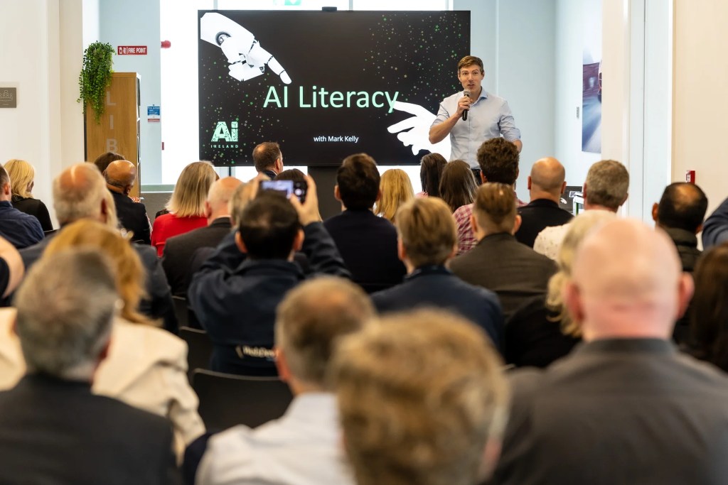 Mark Kelly speaking about AI literacy to a business audience