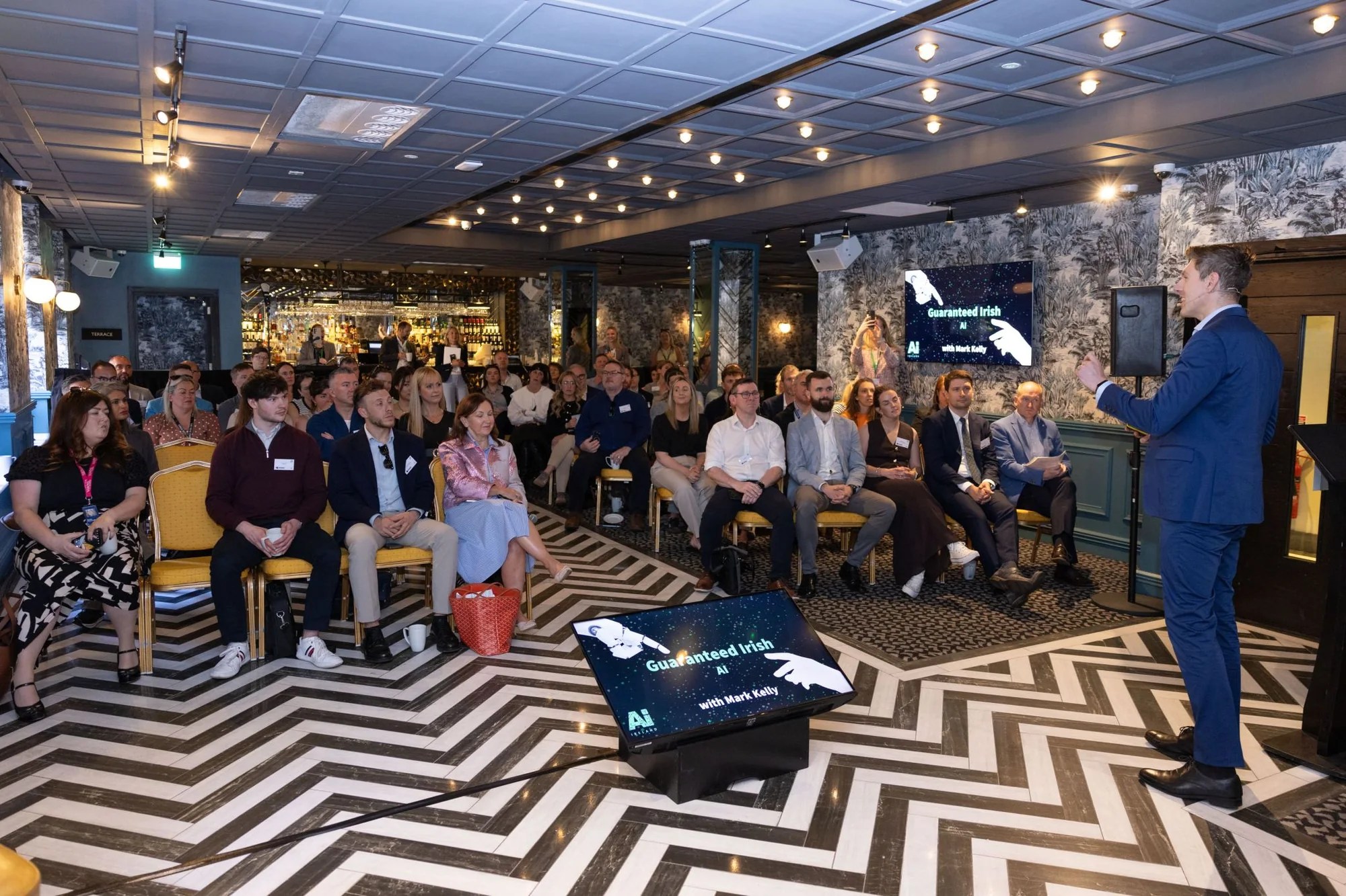 Mark Kelly speaking to business leaders at a Guaranteed Irish AI event